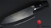 
                    Il Kyocera Black Santoku con il manico di legno di Pakka