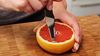 
                    grapefruit knife preparing a grapefruit